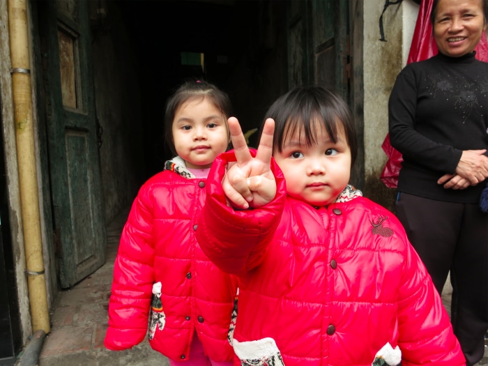 Vietnamese girls peace sign Hanoi