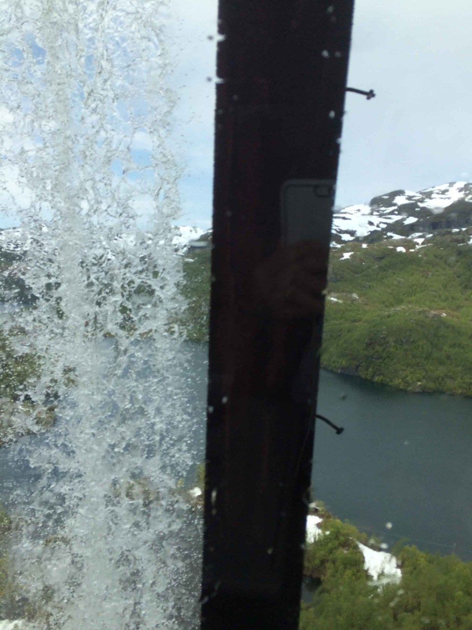 In many sections, the train balances on tracks on the side of the mountain, even passing under cascading water.