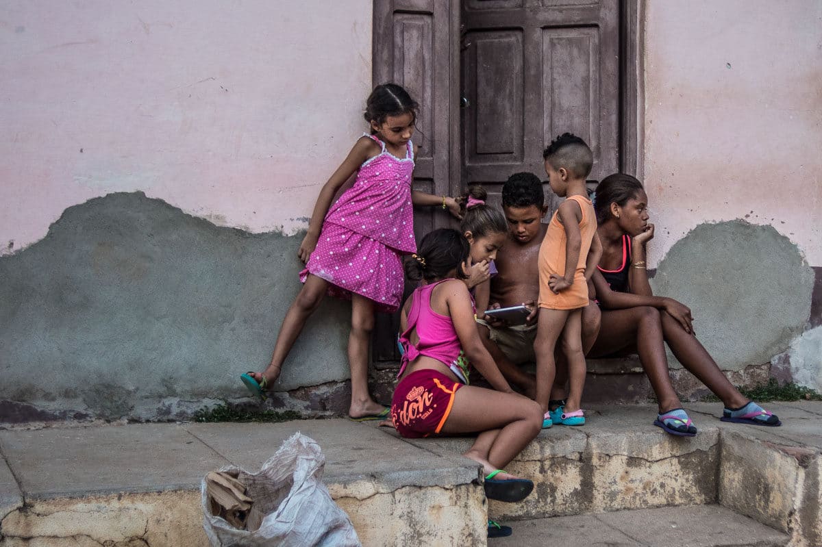 Trinidad kids with ipad travel to cuba vacation