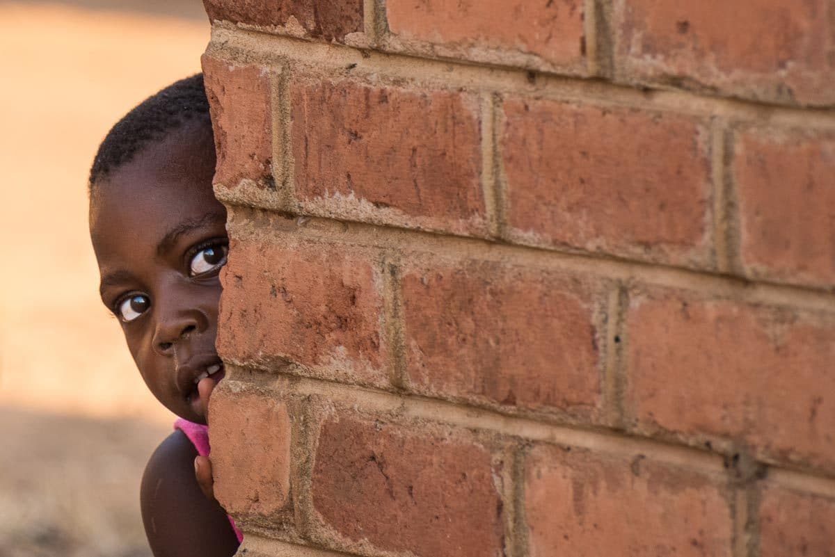 Malawi Vwaza girl in village peeking