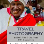Joyful Cuban woman in traditional white headwrap and red dress smoking a cigar in Havana — travel photography photos and tips from 80+ countries at TravelPast50.com.