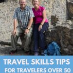 Tom and Kris Bartel of TravelPast50.com sitting among the ancient ruins of Herculaneum, Italy — travel skills tips for travelers over 50.