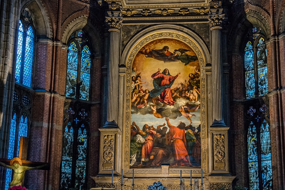 The high altar of the Basilica di Santa Maria Gloriosa dei Frari in Venice, Italy. The painting is Titian's masterpiece, the Assumption of the Virgin.