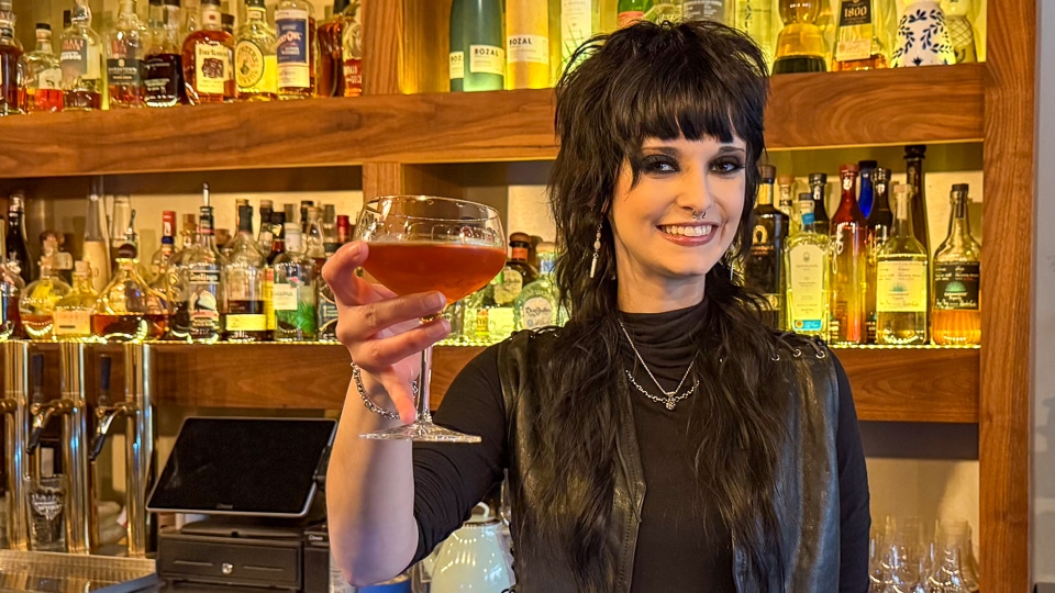 Bartender Shirley mixing a cocktail at The Narrows bar in Juneau, Alaska